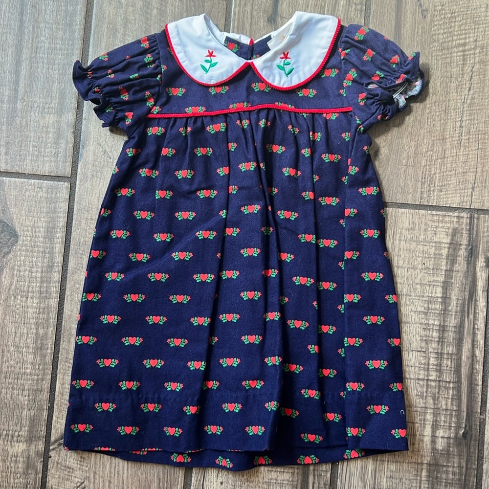 The Beaufort Bonnet Company navy dress with red heart detail.